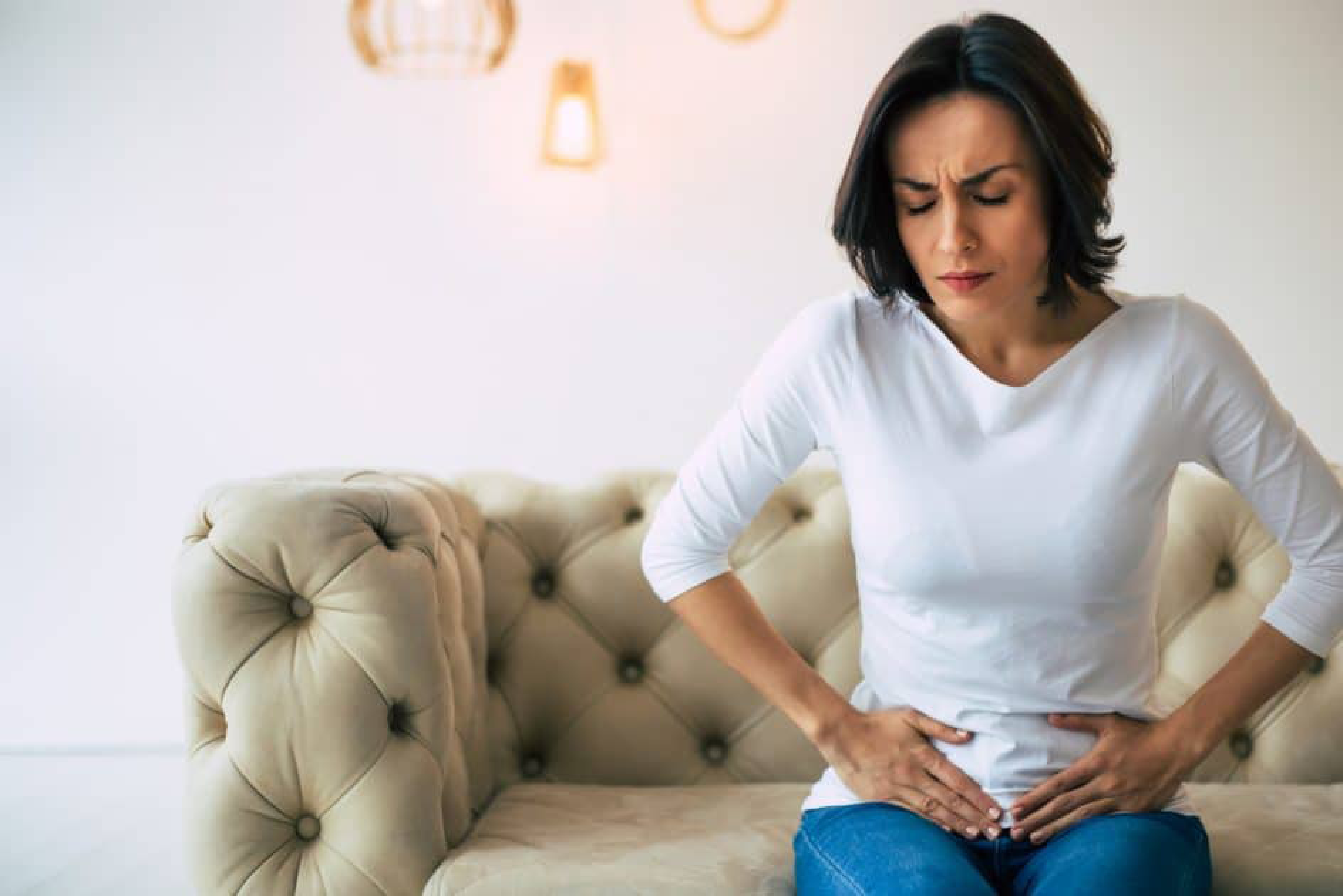 Woman holding belly with pelvic pain