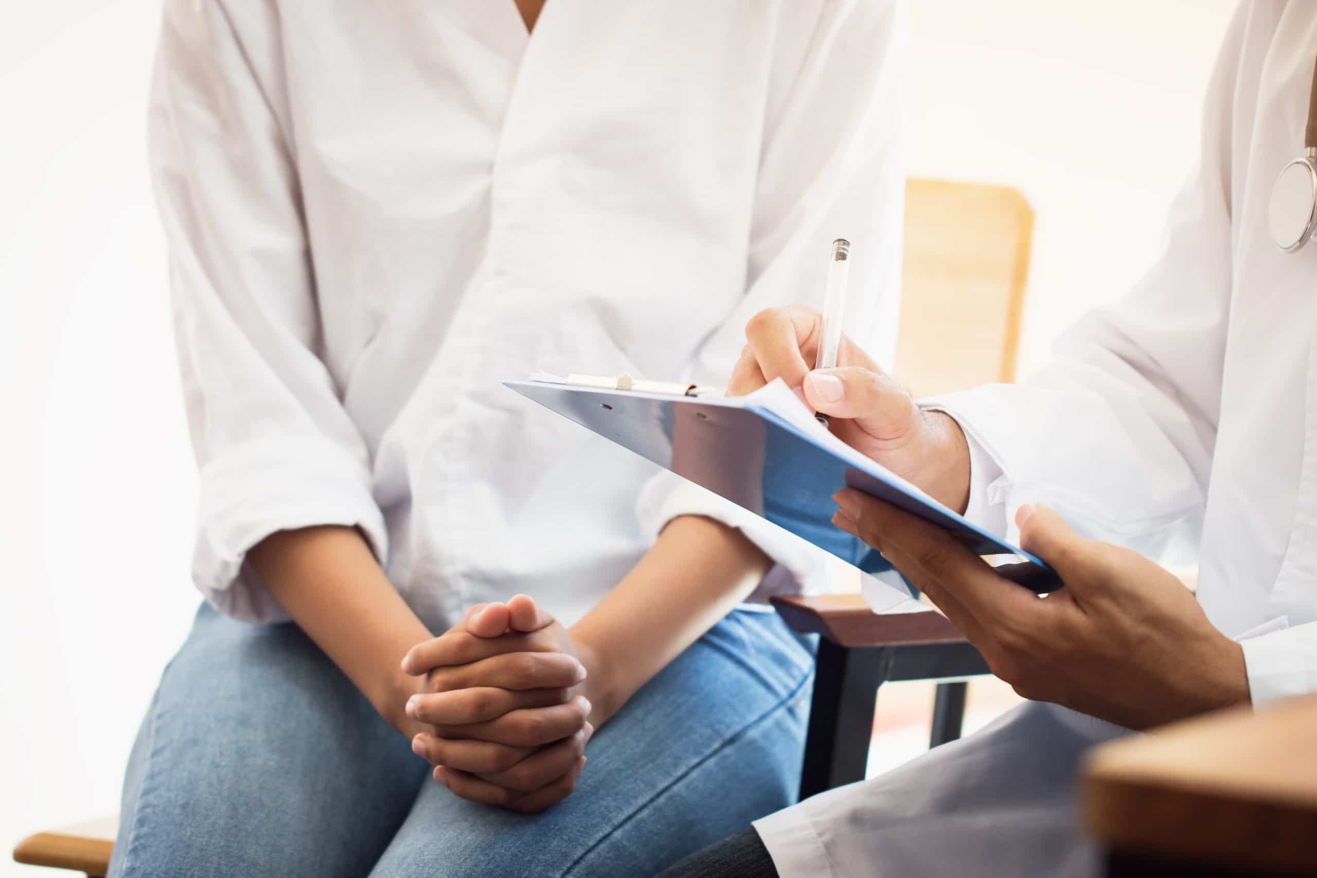 A woman with endometriosis consults a trusted physician like the ones at the Endometriosis Treatment Center of America